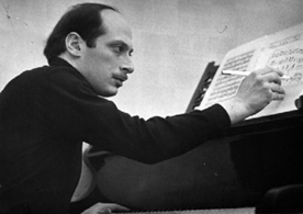 A man sitting at the piano playing music.